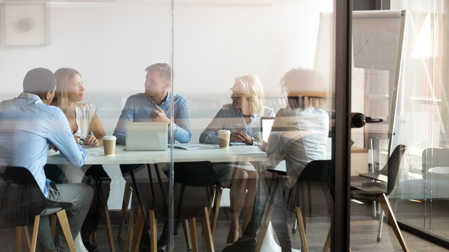 People talking in a conference room - simulating the voice of the customer